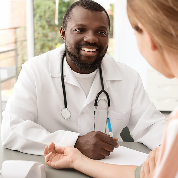 Medical Professional with Patient; Conceptual Image