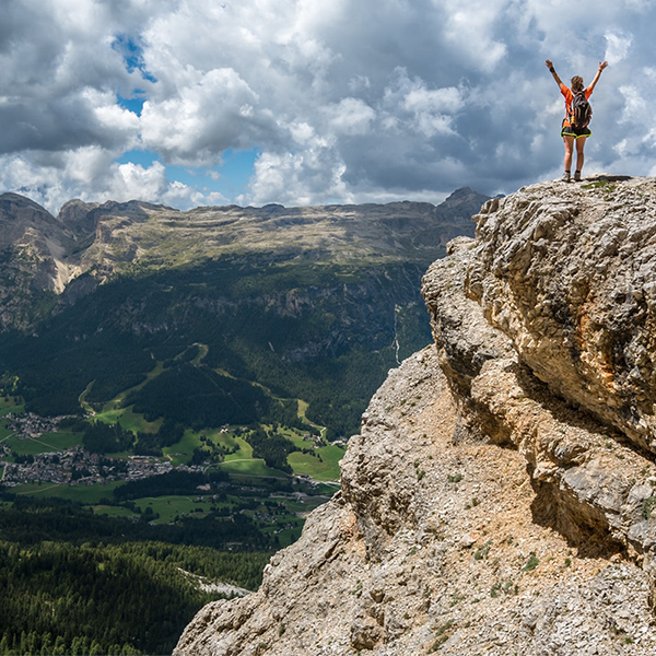 Woman Mountain Climber Reaching Summit; Conceptual Image