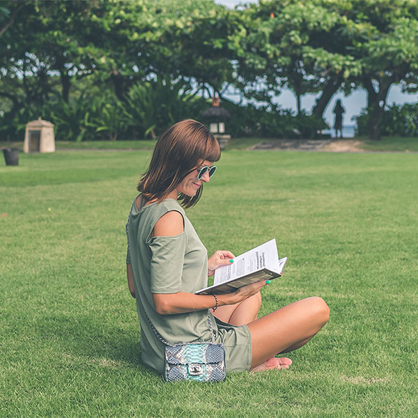 Woman reading a book, relaxing; Conceptual Image